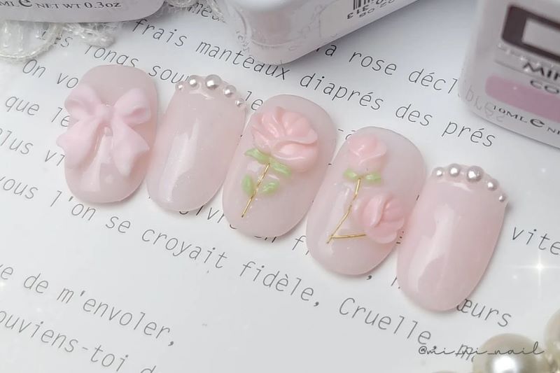 Nhẹ nhàng với màu móng tay hồng pastel thêm hoa 3d nổi bật