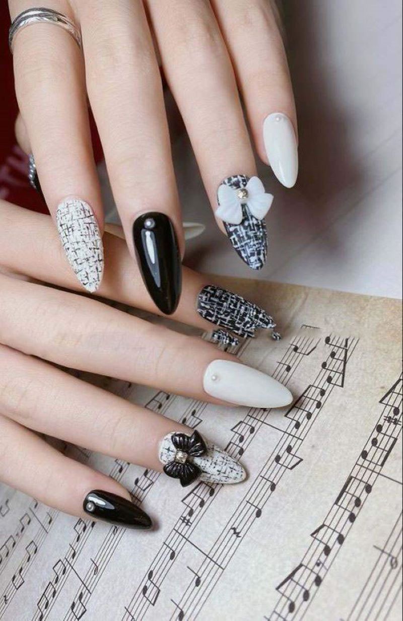 Mẫu nail đen trắng đính nơ